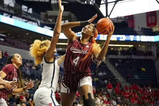 South Carolina forward Aliyah Boston (4) shoots over Mississippi forward Shakira Austin (0) during the first half of an NCAA college basketball game in Oxford, Miss., Sunday, Feb. 27, 2022. South Carolina won 71-57. (AP Photo/Rogelio V. Solis)