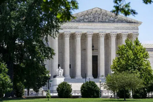 The Supreme Court is seen on Capitol Hill in Washington, July 14, 2022. The Supreme Court ruling expanding gun rights threatens to upend firearms restrictions across the country as activists wage court battles over everything from bans on AR-15-style guns to age limits. (AP Photo/J. Scott Applewhite, File)