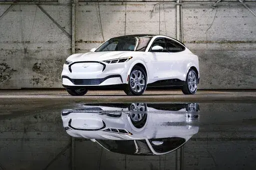 This photo provided by Ford shows the 2022 Ford Mustang Mach-E, a compact electric SUV with an EPA-estimated range of 224-314 miles depending on the configuration. (Courtesy of the Ford Motor Co. via AP)