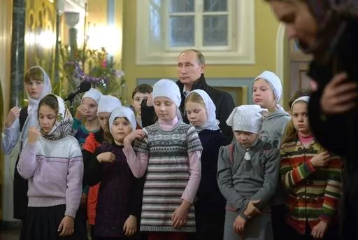 Russian President Vladimir Putin attends a midnight Mass on Russian Orthodox Christmas in the village of Turginovo, about 150 kilometers (90 miles) northwest of Turginovo, Russia on Jan. 7, 2016. As Putin has formed a closer alliance with the Orthodox Church, the country has embraced what officials call “traditional values,” and Russia has sought to put more restrictions on abortion. Russia’s health minister has condemned women for prioritizing careers over childbearing. (Alexei Druzhinin,