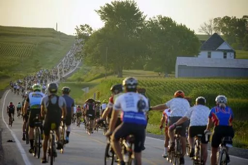 Riders roll out of Tama-Toledo, Iowa, during RAGBRAI 50, Friday, July 28, 2023. (Zach Boyden-Holmes/The Des Moines Register via AP)