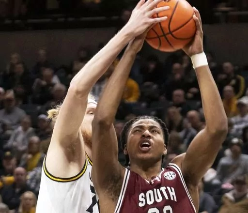 South Carolina's Collin Murray-Boyles, right, has his shot blocked by Missouri's Connor Vanover, left, during the first half of an NCAA college basketball game Jan. 13, 2024, in Columbia, Mo. South Carolina is No. 15 in the latest AP Top 25 poll for its first ranking in nearly seven years. (AP Photo/L.G. Patterson, File)